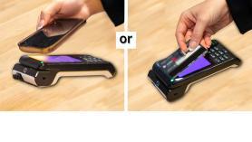 Credit card being tapped on payment machine