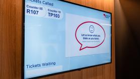 Your turn (image showing a screen in a service centre when a ticket is called)