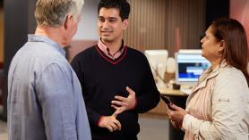 Customers talking to a Service NSW member waiting