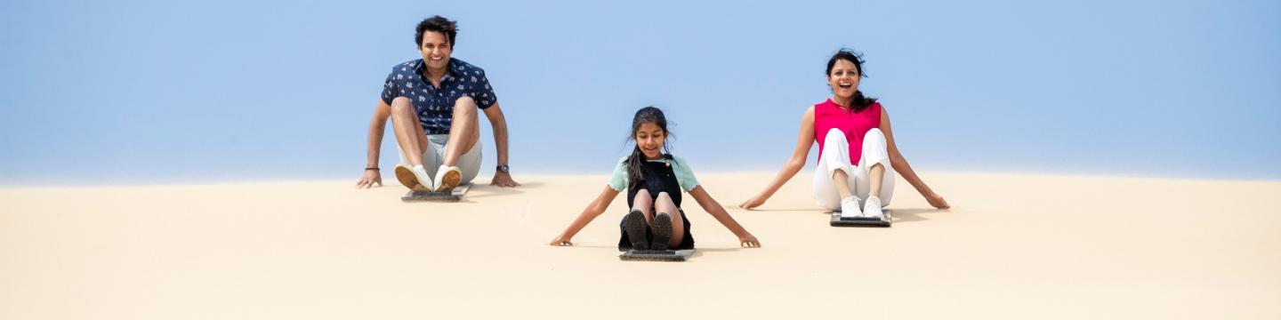 Family holidaying on sand dunes